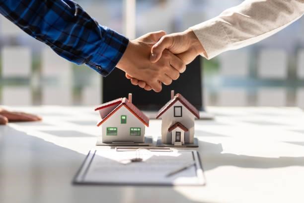 real-estate-agents-shake-hands-after-the-signing-of-the-contract-agreement